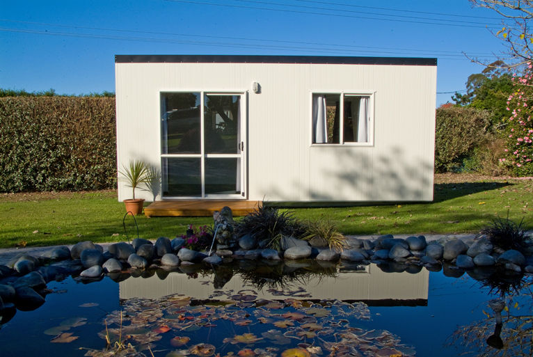 Portable cabin next to a small pond
