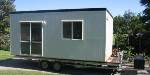 Cabin sitting on a trailer for relocation